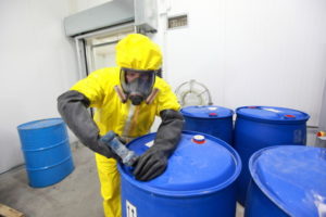 Worker in a chemical plant, who is at a high risk of suffering injury while on the job.