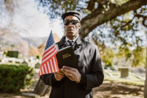 Man with an American Flag Reading the Bible