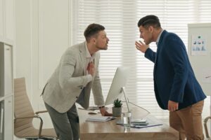 colleagues fighting at table