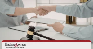 North Carolina worker reviewing a clincher agreement with an attorney before signing a workers' compensation settlement