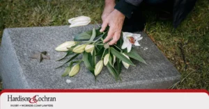 A family taking flowers to a loved ones deathbed in Greensboro, North Carolina