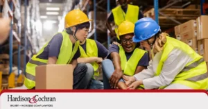 Injured worker reviewing Greensboro workers' compensation FAQs in North Carolina