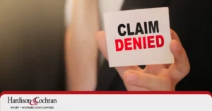 North Carolina driver reviewing a denied car accident insurance claim letter